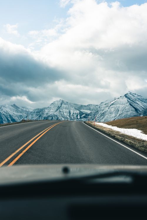 Free A picturesque road trip with snow-capped mountains in Waterton Park, Canada. Stock Photo