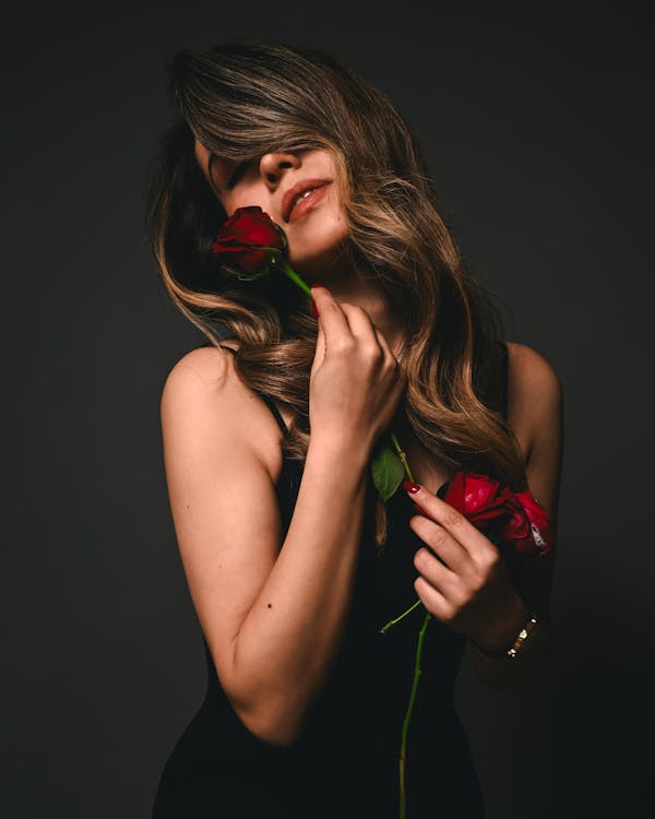 Young Woman Holding Red Roses 