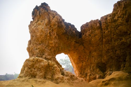 Free A stunning natural arch formation captured at sunrise, showcasing rugged beauty. Stock Photo