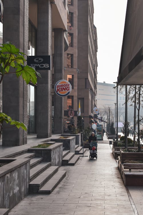 Burger King Logo by Pavement in City Downtown