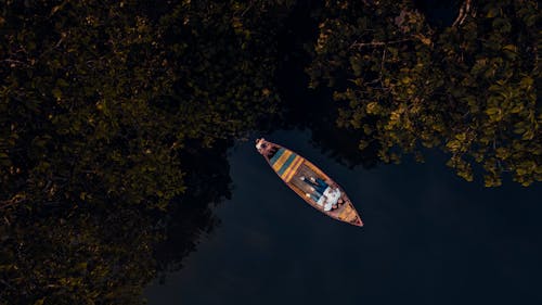 People Lying on Back on Boat