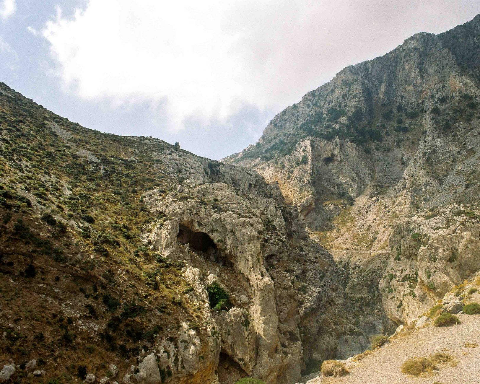 Explore the eroded rocky landscape and mountains of Greece, capturing natural beauty.