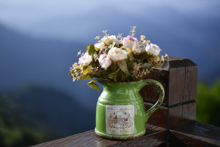 Roses In A Green Enamel Jug