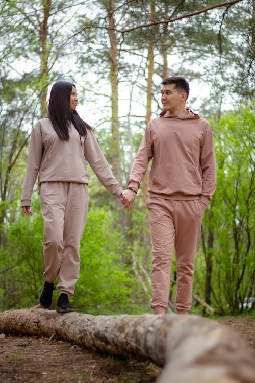 Couple Walking Along the Forest