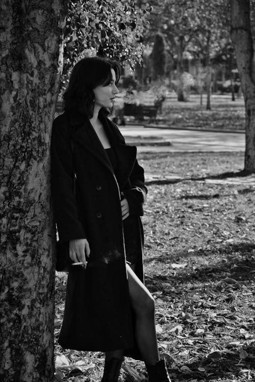 Woman Wearing Coat in Park in Black and White