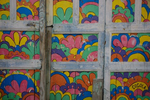 Close-up of an Old Wooden Surface with Colorful Paintings
