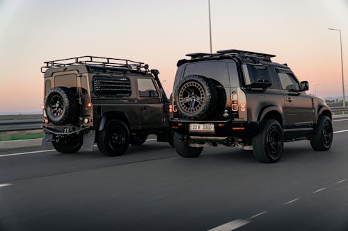 Land Rover Defenders on the Street