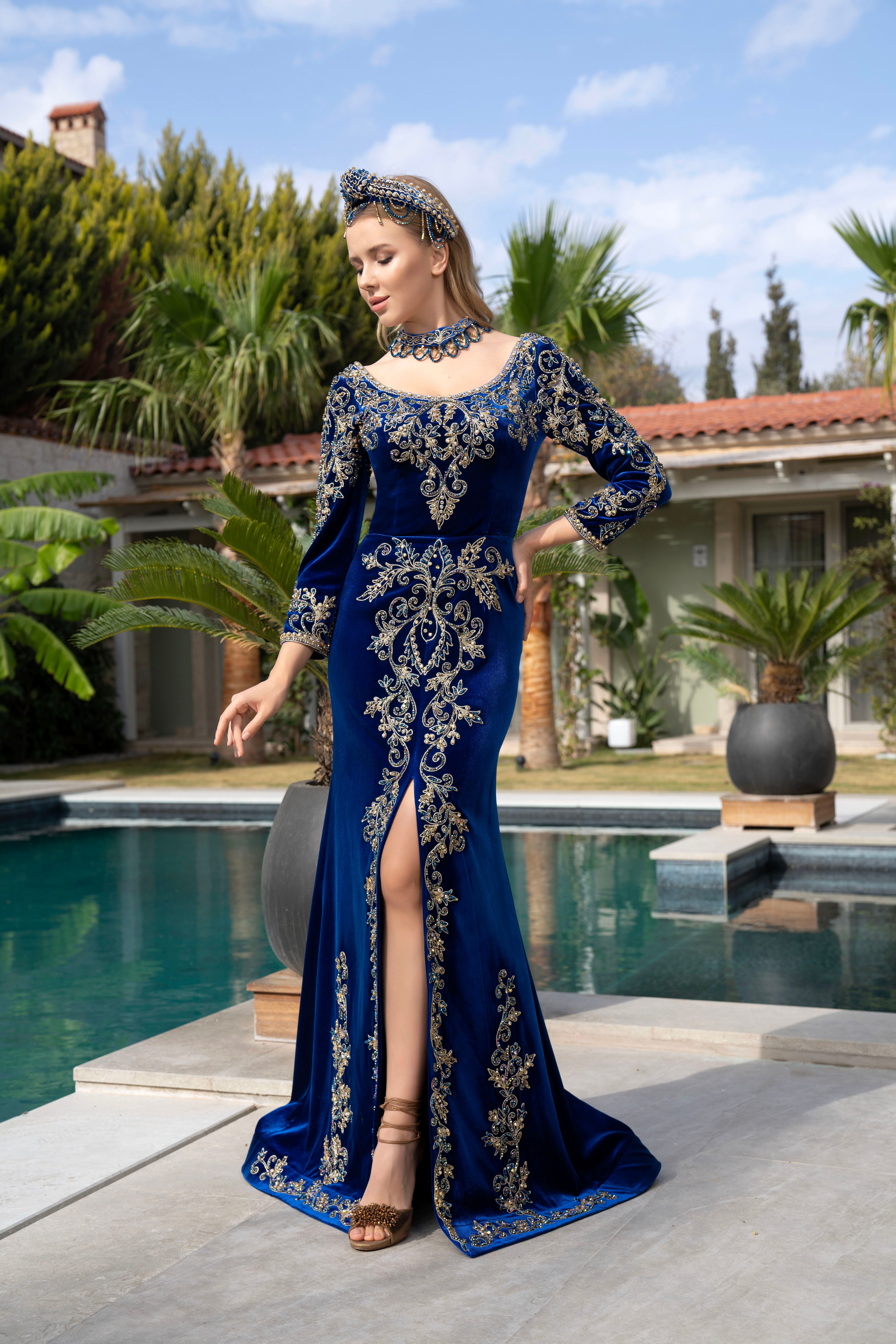 Woman in navy velvet evening gown