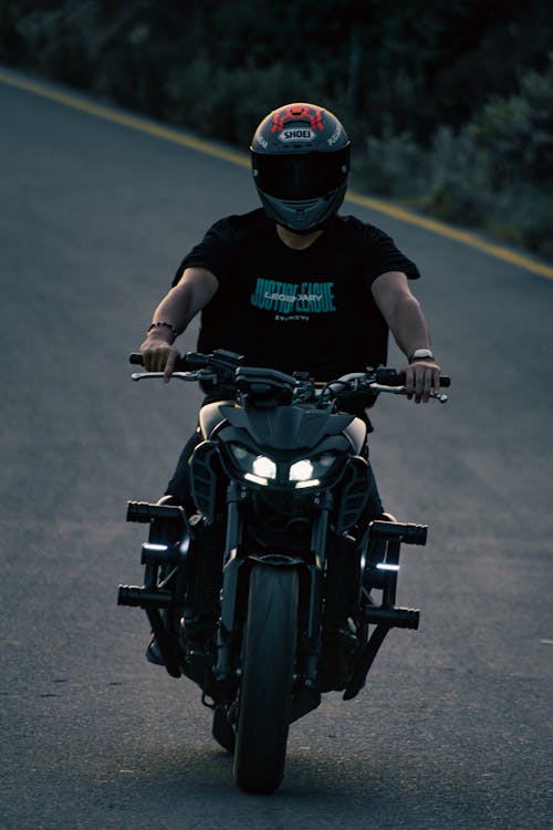 Man Riding on a Black Yamaha MT Motorcycle 