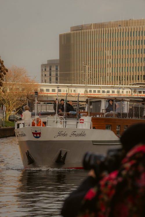 People on a White Ferry on a River