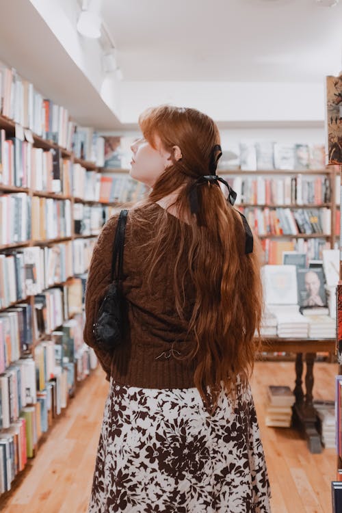 Back View of Redhead Woman in Library