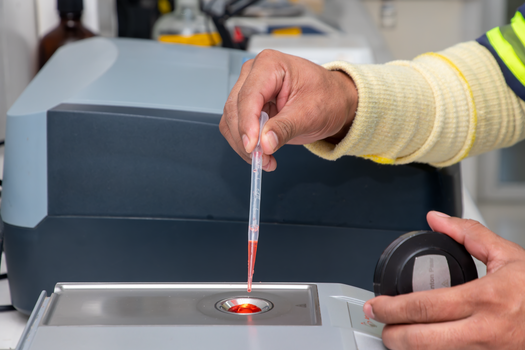 lab technician testing herbal extract