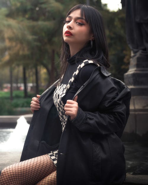 Woman Sitting in Black Jacket