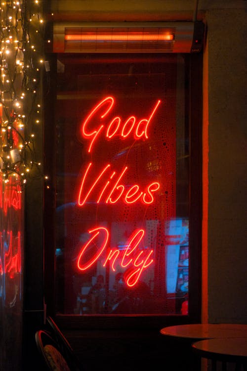 Neon Good Vibes Only in the Window of a Cafe