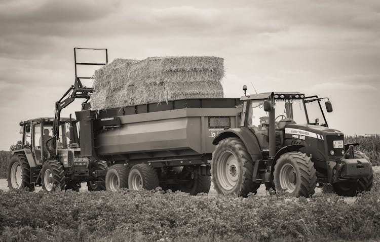 Tractors With Hay On Trailer