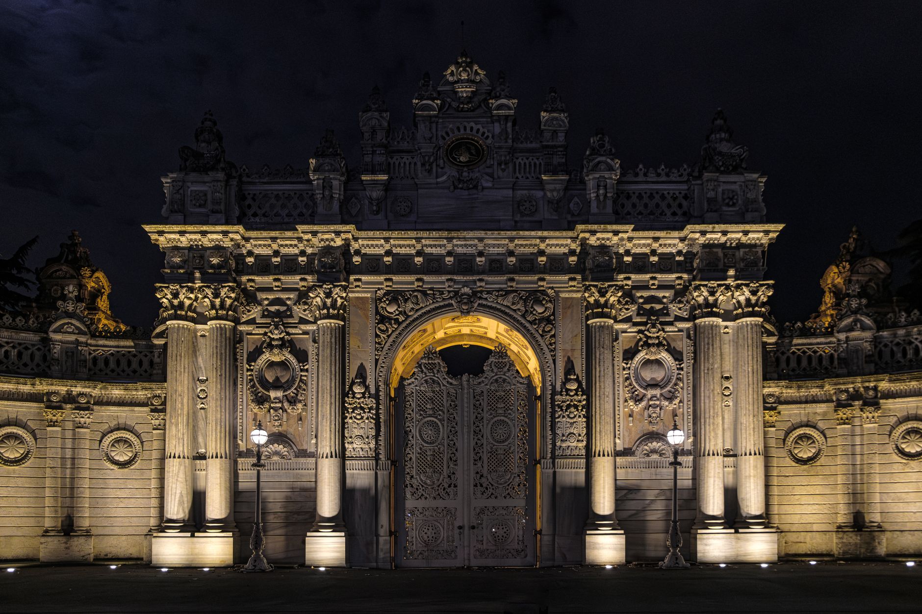 Illuminated Gate of the Sultan at Dolmabahçe Palace in Istanbul, a stunning Baroque Revival landmark.