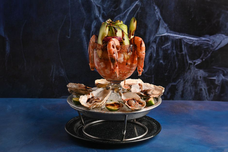 A towering seafood platter at Joe Muer Seafood, showcasing fresh shellfish and oceanic delights - fancy restaurants in metro detroit A towering seafood platter at Joe Muer Seafood, showcasing fresh shellfish and oceanic delights - fancy restaurants in metro detroit