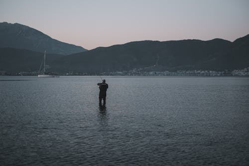 Fisherman Standing Water at Dawn
