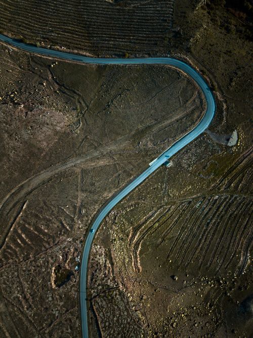 Free Aerial shot of a winding road cutting through a barren, arid landscape in İncesu, Kayseri, Türkiye. Stock Photo