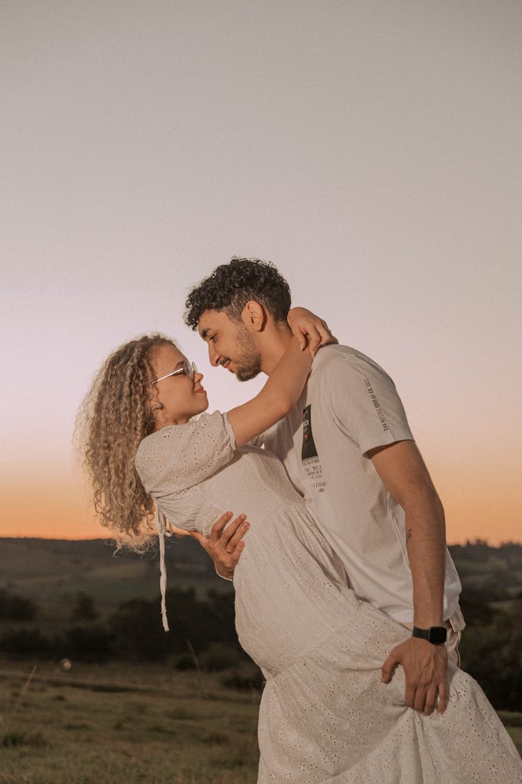 Couple In White Clothing Posing Together 