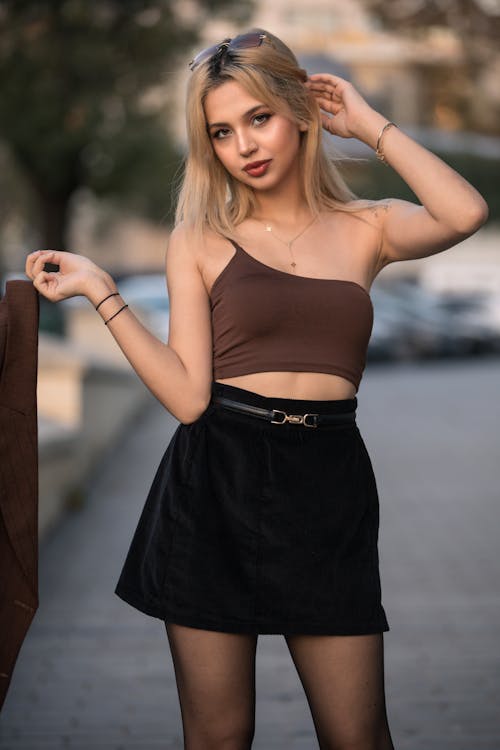 Beautiful Woman in Brown Top and Black Skirt