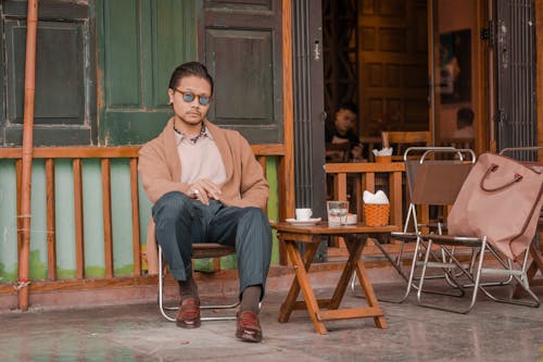 Well-dressed Man Sitting in Cafe