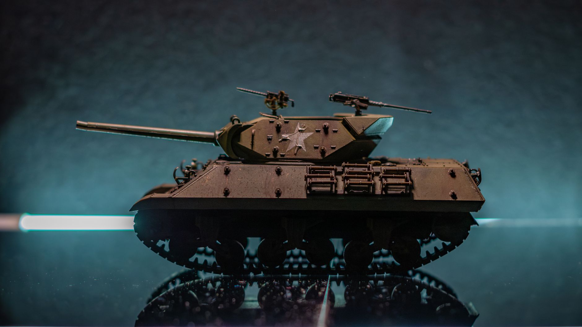 A detailed model of a military tank on a reflective surface with a dramatic background.