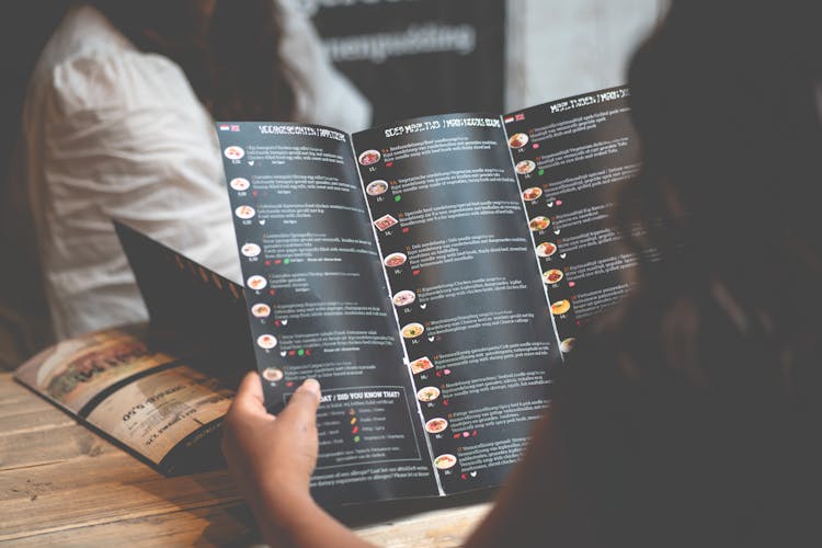 Woman Reading Menu