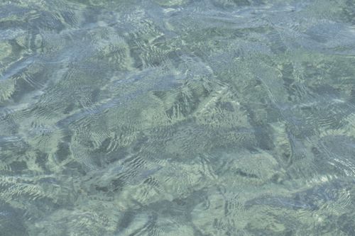 Free Close-up view of ocean water with gentle ripples, creating a calming texture. Stock Photo