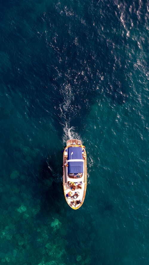 People on Motorboat on Sea