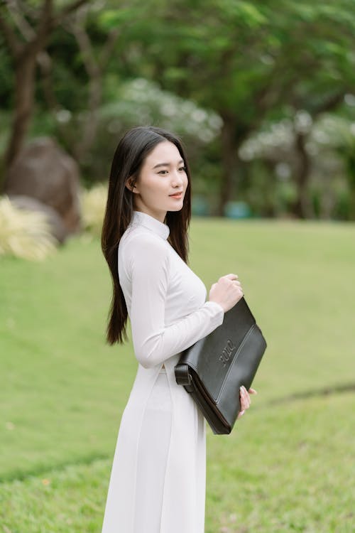 Portrait of Woman in White Dress