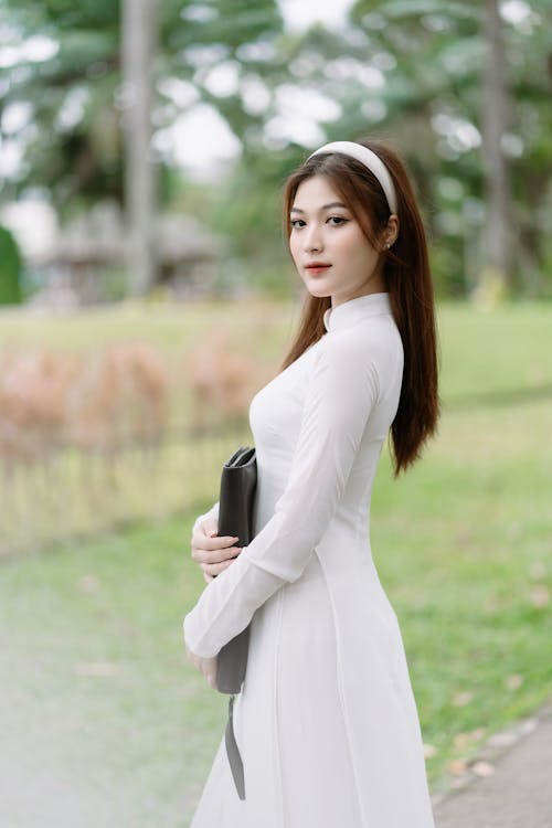 Young Model in a White Traditional Ao Dai Tunic
