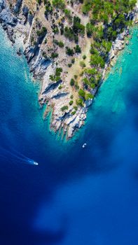 Stunning aerial view of Mersin, Türkiye, showcasing clear azure waters and rugged coastline.