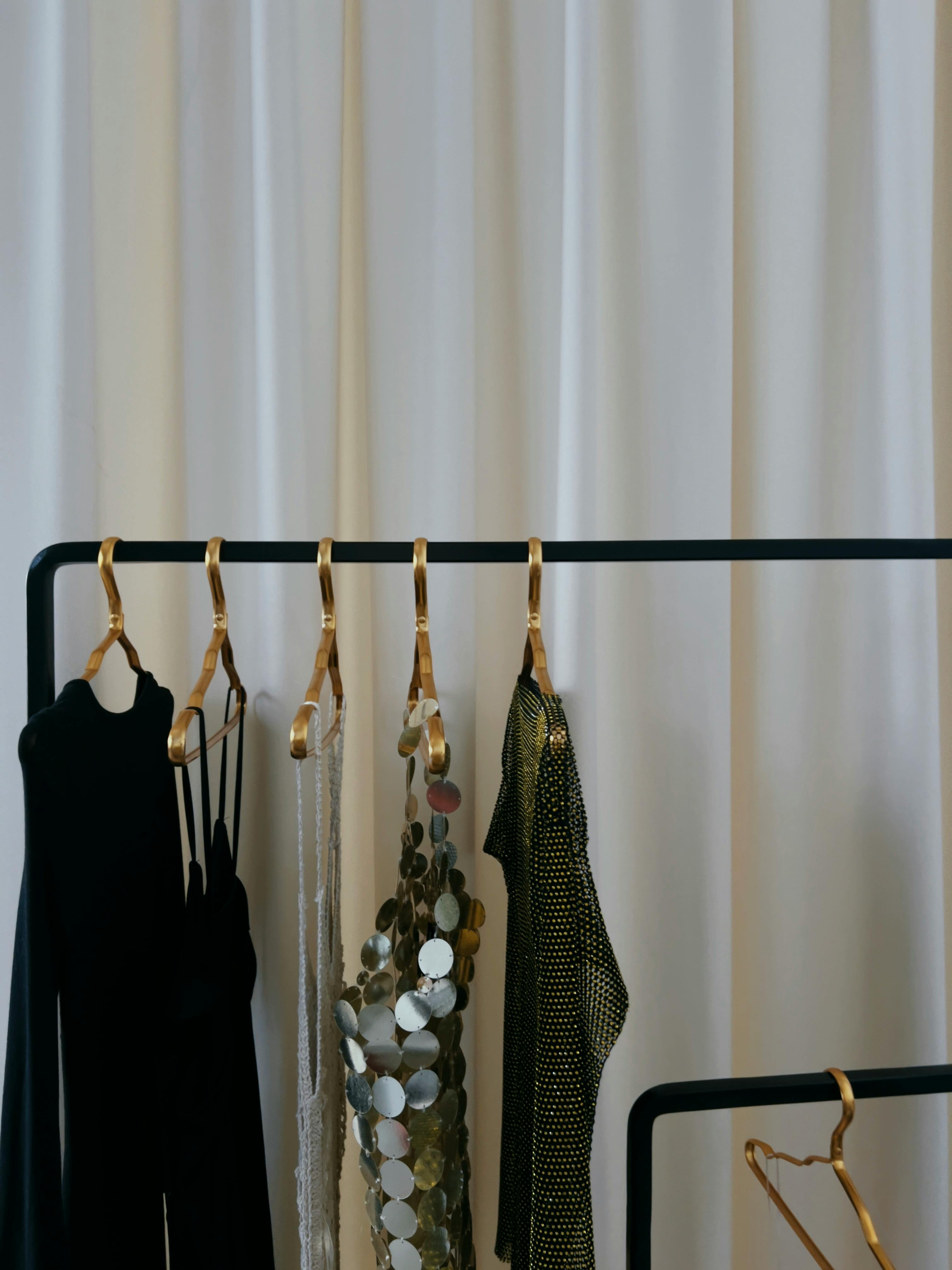 Dresses Hanging on a Clothing Rack Free Stock Photo