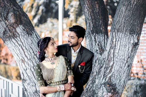 Indian Wedding Couple in Front of a Tree 