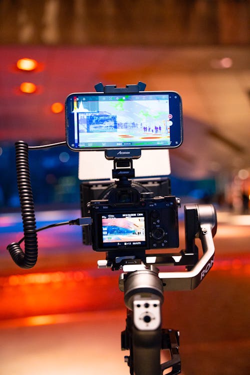 Close-up of a Camera and Smartphone on a Stabilizer 