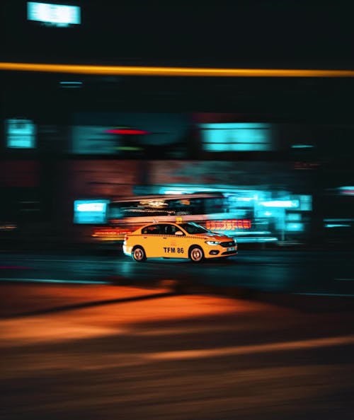 Taxi on Street at Night