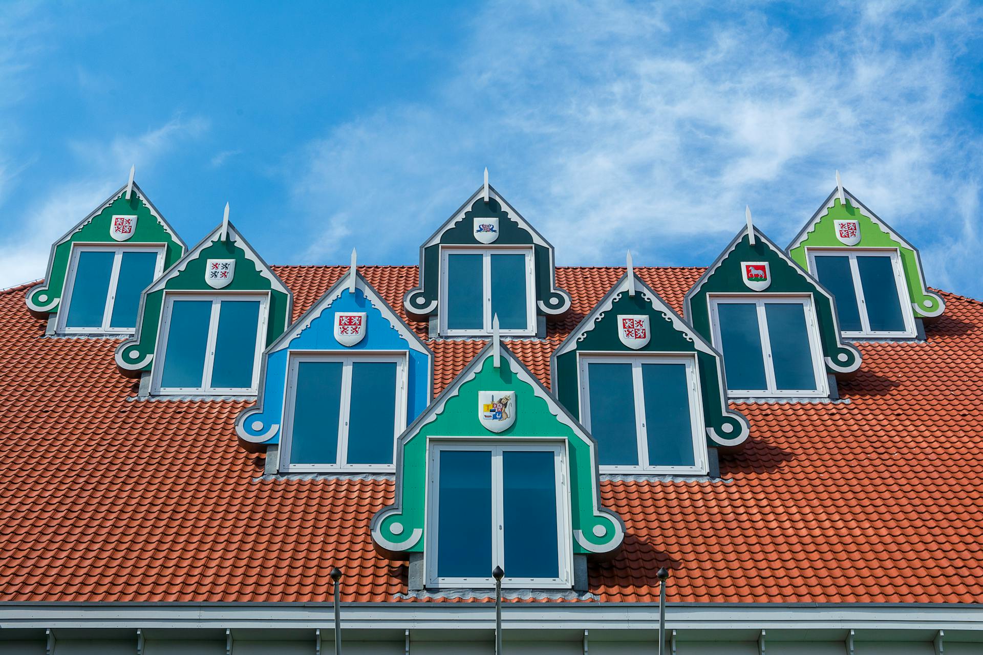 Decorative Dormer Windows with Coats of Arms of Different Cities