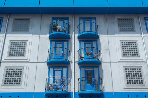 Facade of an Apartment Building with Blue Balconies 