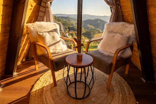 Chairs and a Coffee Table by the Window with a Mountain View