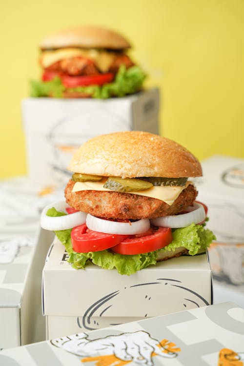 Close-up of Burgers Standing on Boxes 