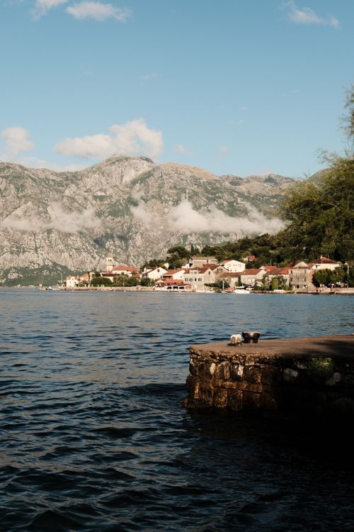 Free Discover the tranquil beauty of Kotor Bay with coastal towns and mountain backdrop. Stock Photo