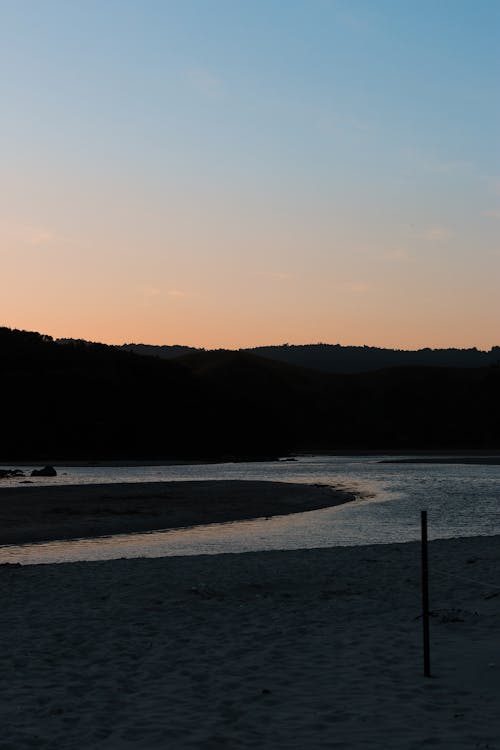 Безкоштовне стокове фото на тему «велика річка, Захід сонця, пляж»