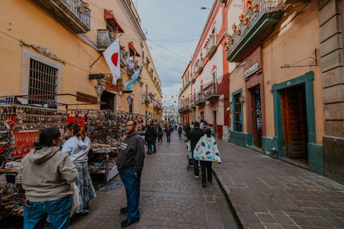 View of People Walking in an Alley with Market Stalls in Guanajuato, Mexico 