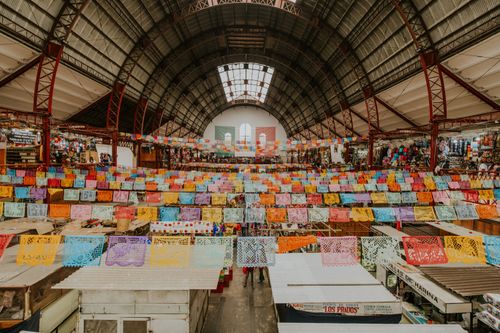 Free Colorful paper banners adorn the bustling Mercado Hidalgo in Guanajuato, Mexico. Stock Photo