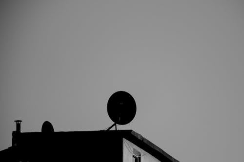 Antenna on Building Roof in Black and White