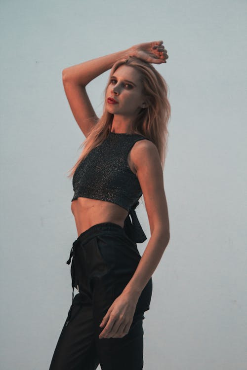 Blonde Model Posing in Black Pants