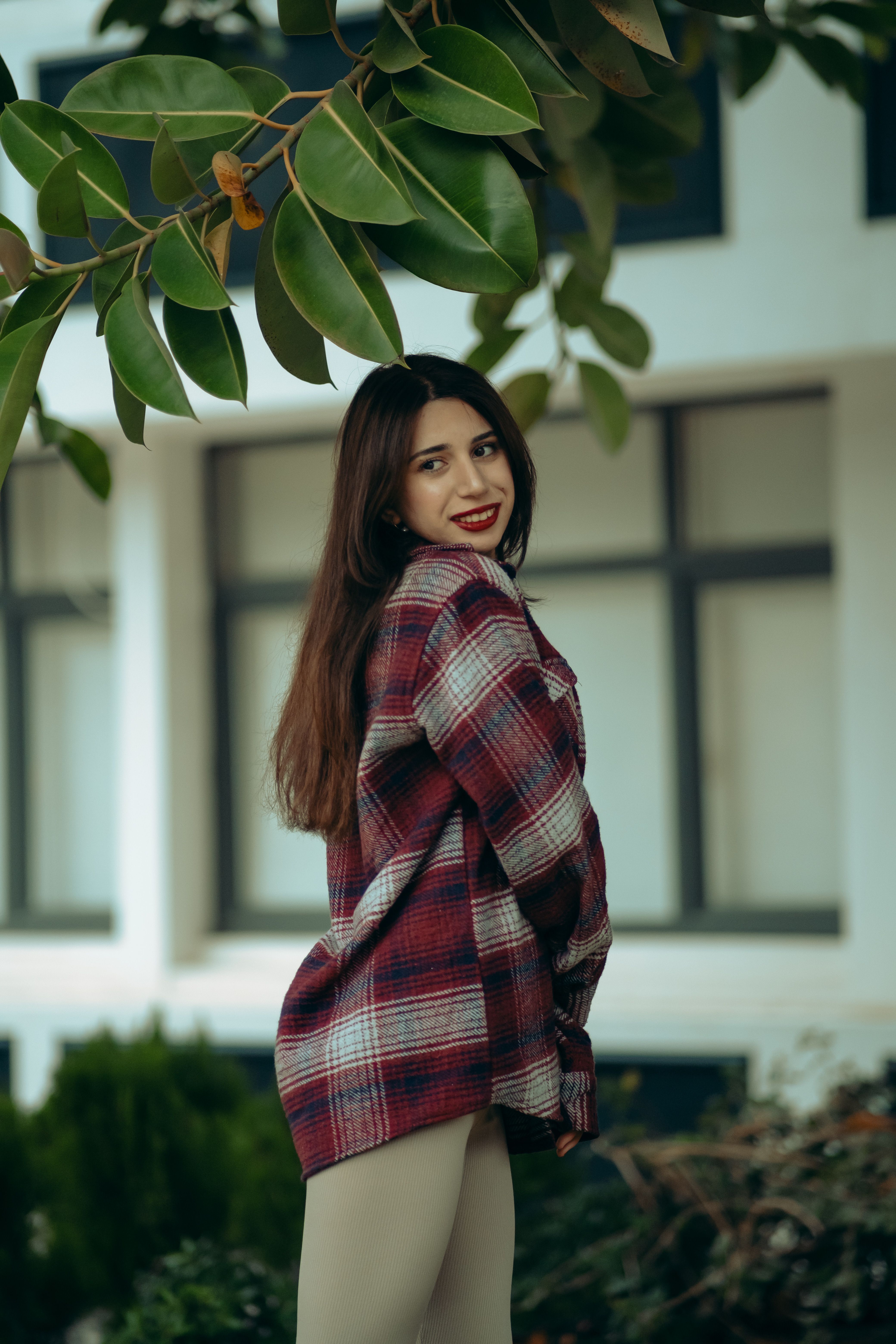 Woman in plaid flannel and band tee