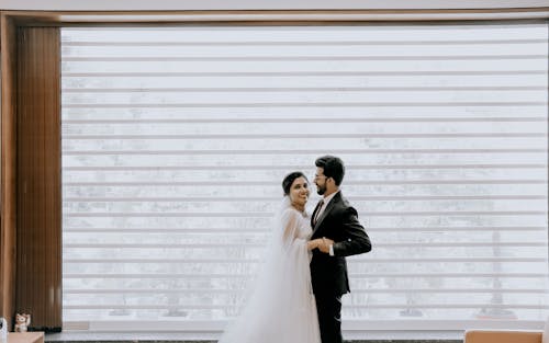 Bride and Groom Hugging and Smiling