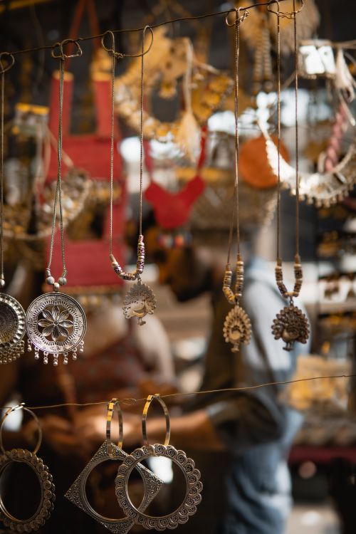 Free Intricate traditional jewelry on display at a bustling street market. Stock Photo